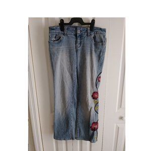 Guess jeans with embroidery.  Ladies size 28. Low